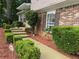 Inviting split-level home featuring manicured shrubs, a sidewalk entrance, and a blend of siding and brick at 4678 Browns Mill Ferry Rd, Lithonia, GA 30038
