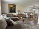 Comfortable living area with plush seating, stylish decor, and an open layout into the dining area at 4678 Browns Mill Ferry Rd, Lithonia, GA 30038