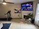 Comfortable living room area featuring a fireplace, television, and open floor plan at 4678 Browns Mill Ferry Rd, Lithonia, GA 30038