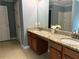Bathroom with double sinks, granite countertops, and ample storage space, providing a stylish and functional design at 10175 Hemlock Way, Jonesboro, GA 30238