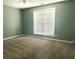 Bedroom has soft carpeting, natural light, and is ready for personalization to create a cozy retreat at 10175 Hemlock Way, Jonesboro, GA 30238