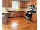 Well-lit kitchen boasts stainless appliances, granite countertops and a mosaic backsplash, perfect for cooking at 10175 Hemlock Way, Jonesboro, GA 30238