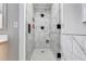 Sleek bathroom featuring a shower with elegant marble tiling and modern fixtures at 212 Teepee Trl, Whitesburg, GA 30185