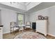 Bright bedroom features light gray walls, wood-look floors, and a stylish rug at 212 Teepee Trl, Whitesburg, GA 30185