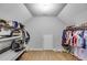 Walk-in closet with hardwood flooring, clothing racks, and a lot of storage at 212 Teepee Trl, Whitesburg, GA 30185