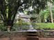 Picturesque backyard featuring a shed with a stone walkway and lush greenery at 3317 Shady Oak Dr, Atlanta, GA 30340