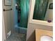 Bathroom featuring a shower/tub combination with a green shower curtain and blue tile at 3317 Shady Oak Dr, Atlanta, GA 30340