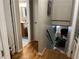 Hallway with hardwood floors, leading to a bathroom and a staircase down to the lower level at 3317 Shady Oak Dr, Atlanta, GA 30340