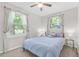 Serene bedroom with a soothing color palette, large windows, and comfortable furnishings at 390 Lincoln Sw Pl, Atlanta, GA 30315