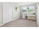 Bright bedroom featuring a large window, neutral walls, closet, and carpet floors at 390 Lincoln Sw Pl, Atlanta, GA 30315