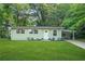 Charming home with a well-manicured lawn, inviting curb appeal, and lovely landscaping at 390 Lincoln Sw Pl, Atlanta, GA 30315