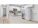 Modern kitchen with white cabinets, stainless steel appliances, granite countertops, and stylish backsplash at 390 Lincoln Sw Pl, Atlanta, GA 30315