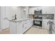 Well-equipped kitchen featuring stainless steel appliances, stone countertops, and a functional island at 390 Lincoln Sw Pl, Atlanta, GA 30315