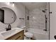 Updated bathroom with modern vanity, stylish lighting, and shower over tub at 4756 Fellsridge Dr, Stone Mountain, GA 30083