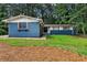 Charming brick home with a manicured lawn and mature trees, featuring unique window details at 4756 Fellsridge Dr, Stone Mountain, GA 30083