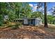 Charming single-story brick home with a welcoming front porch and landscaped yard at 4756 Fellsridge Dr, Stone Mountain, GA 30083