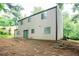 Exterior view of house with backyard in a wooded area at 5092 Stone Trce, Stone Mountain, GA 30083