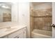 Bathroom featuring tiled shower, vanity with sink, and modern fixtures at 5092 Stone Trce, Stone Mountain, GA 30083