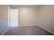 Neutral bedroom showcases plush gray carpeting and a doorway at 5092 Stone Trce, Stone Mountain, GA 30083
