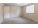 Bright bedroom featuring neutral walls and plush gray carpeting at 5092 Stone Trce, Stone Mountain, GA 30083