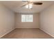 Neutral bedroom features plush carpeting and a window providing natural light at 5092 Stone Trce, Stone Mountain, GA 30083