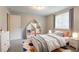 Stylized bedroom featuring area rug, stuffed animals, and natural light at 5092 Stone Trce, Stone Mountain, GA 30083