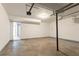 Spacious garage with concrete flooring and access door at 5092 Stone Trce, Stone Mountain, GA 30083