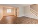 Bright living room features hardwood floors and staircase at 5092 Stone Trce, Stone Mountain, GA 30083