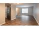 Spacious living room featuring stainless steel refrigerator and hardwood floors at 5092 Stone Trce, Stone Mountain, GA 30083