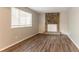 Cozy living room features stone fireplace and hardwood floors at 5092 Stone Trce, Stone Mountain, GA 30083