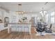 Modern, open-concept kitchen with a large island, stainless steel appliances, and ample counter space at 5310 Chestnut Dr, Cumming, GA 30040