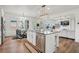 Spacious kitchen features an island, stainless appliances, and adjacent breakfast nook at 5310 Chestnut Dr, Cumming, GA 30040