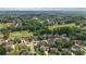 An aerial view of a suburban neighborhood with lush green trees and homes surrounding a golf course at 103 Brightmoor Ct, Canton, GA 30115