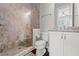 Bathroom featuring a tiled walk-in shower, granite countertops, and white cabinets at 103 Brightmoor Ct, Canton, GA 30115