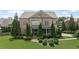 Inviting brick two-story home with manicured lawn and mature landscaping at 103 Brightmoor Ct, Canton, GA 30115