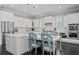 Modern kitchen with white cabinets, stainless steel appliances, and island at 103 Brightmoor Ct, Canton, GA 30115