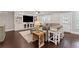 Spacious living room with custom built-ins, hardwood floors and unique breakfast bar at 103 Brightmoor Ct, Canton, GA 30115