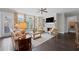 Comfortable living room with a fireplace, built-in shelves, and large windows at 103 Brightmoor Ct, Canton, GA 30115