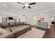 Comfortable living room with ample seating, hardwood floors and neutral color palette at 103 Brightmoor Ct, Canton, GA 30115