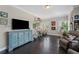 Spacious living room with hardwood floors, a TV, and bright colors at 103 Brightmoor Ct, Canton, GA 30115