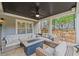 Covered patio with comfortable seating around a modern fire pit, great for relaxation at 103 Brightmoor Ct, Canton, GA 30115