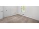 Neutral bedroom featuring carpet, fresh paint, natural light and white doors at 245 Amanda Ct, Stockbridge, GA 30281