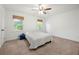 Neutral bedroom featuring carpet, fresh paint, natural light and a ceiling fan at 245 Amanda Ct, Stockbridge, GA 30281