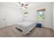Neutral bedroom featuring carpet, fresh paint, natural light, a ceiling fan and window shades at 245 Amanda Ct, Stockbridge, GA 30281