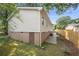 Side view of the house with a small entry door on the basement level at 245 Amanda Ct, Stockbridge, GA 30281