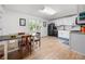 Bright kitchen and dining area with modern appliances and white cabinetry at 245 Amanda Ct, Stockbridge, GA 30281