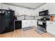 Renovated kitchen featuring new stainless steel appliances and white cabinetry at 245 Amanda Ct, Stockbridge, GA 30281