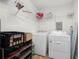 Laundry room featuring washer, dryer, storage shelving, and ample space at 245 Amanda Ct, Stockbridge, GA 30281