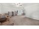 Spacious living room with carpet flooring, neutral paint, and large window at 245 Amanda Ct, Stockbridge, GA 30281