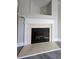 Close-up of the fireplace with a beautiful mantel and hearth at 2612 Haligan Pt, Riverdale, GA 30296